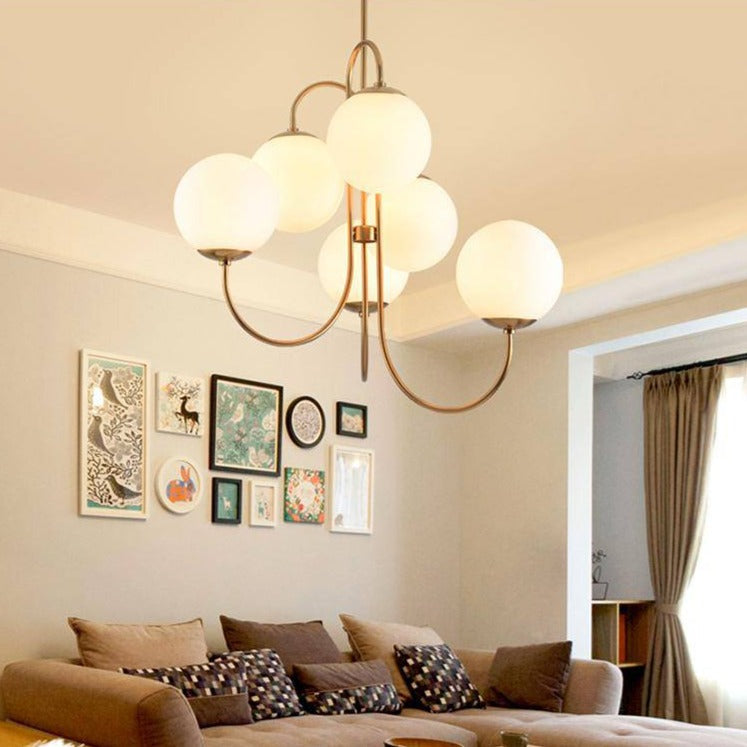Elegant Chandelier with Golden Branches and Glass Globe